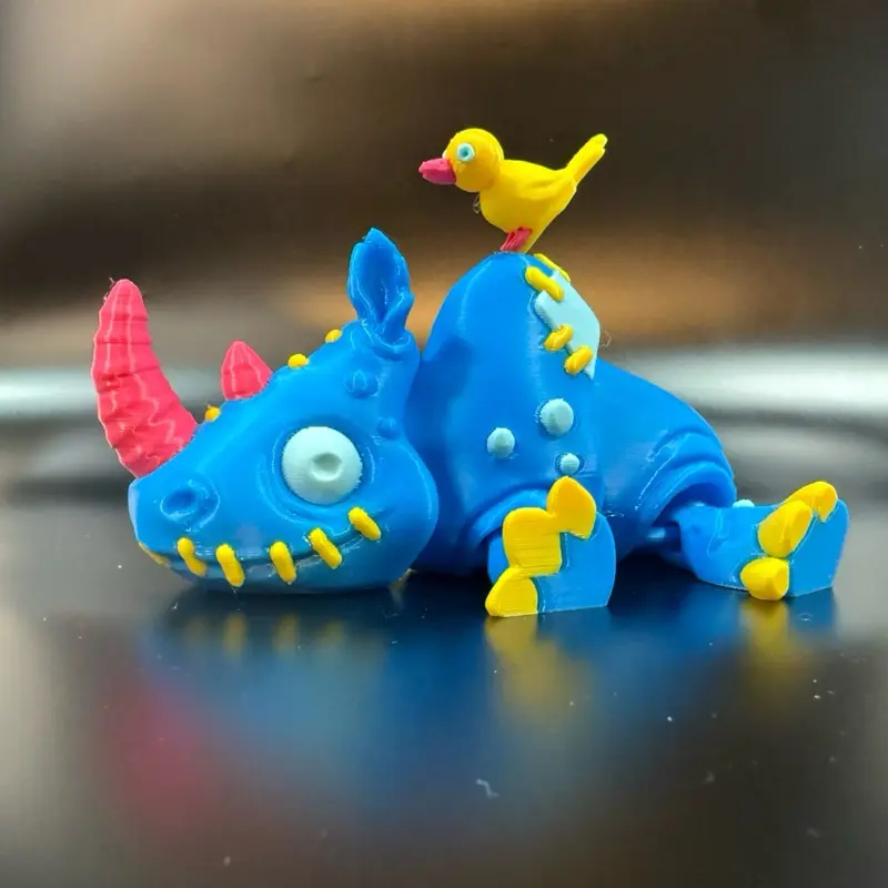 Twisty Prints 3D Printed Patchwork Rhino with yellow bird Collectible - Spooky Halloween Party Favor & Unique Decoration - Lightweight & Durable - 4 1/2 Inches Tall - Articulated Design - Eco-Friendly PLA Filament Ornaments
