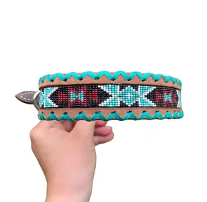 Genuine leather dog collar with teal, white, and burgundy beaded inlay design, a rawhide wrapped edge Genuine leather dog collar with teal, white, and burgundy beaded inlay design, a rawhide wrapped edge