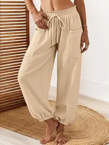 Women's casual khaki pants, with a waist tie, side pockets, and elasticated cuffs at the bottom. These pants are highly versatile and suitable for daily wear, beach outings, going out to work, or commuting.