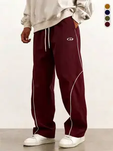 Men’s burgundy wide-leg athletic pants featuring curved white lines, Y2K retro print, drawstring design, casual style; American street-style color-block sportswear made from lightweight fabric for spring/summer—breathable and comfortable, classic design.