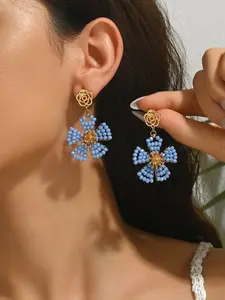 A pair of handcrafted, bohemian-style vintage dangle earrings featuring beaded floral designs—the perfect gift for a loved one, mother, or friend. An ideal present for Valentine's Day, Mother's Day, International Women's Day, wedding season, Thanksgiving