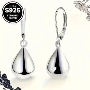A pair of silver teardrop earrings with water droplet pendants. These versatile jewelry pieces are suitable for all seasons and are ideal for daily wear, as well as perfect gifts for birthdays and Valentine's Day.