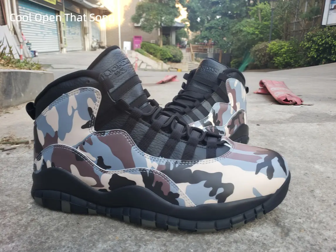 Neutral desert camouflage print high top sneakers black mesh lace straps solid black padded inner collar wavy sculpted black midsole segmented dark traction outsole perfect for rugged streetwear outdoor hiking style and neutral tone fashion shooting