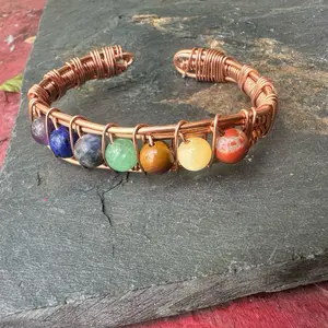 Copper Chakra Bracelet with 7 colorful crystals.