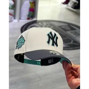 New Era NY Yankees 9FORTY Snapback Hat White Crown Grey Brim Baseball Cap Featuring Black Teal NY Logo And Retro World Series Patch