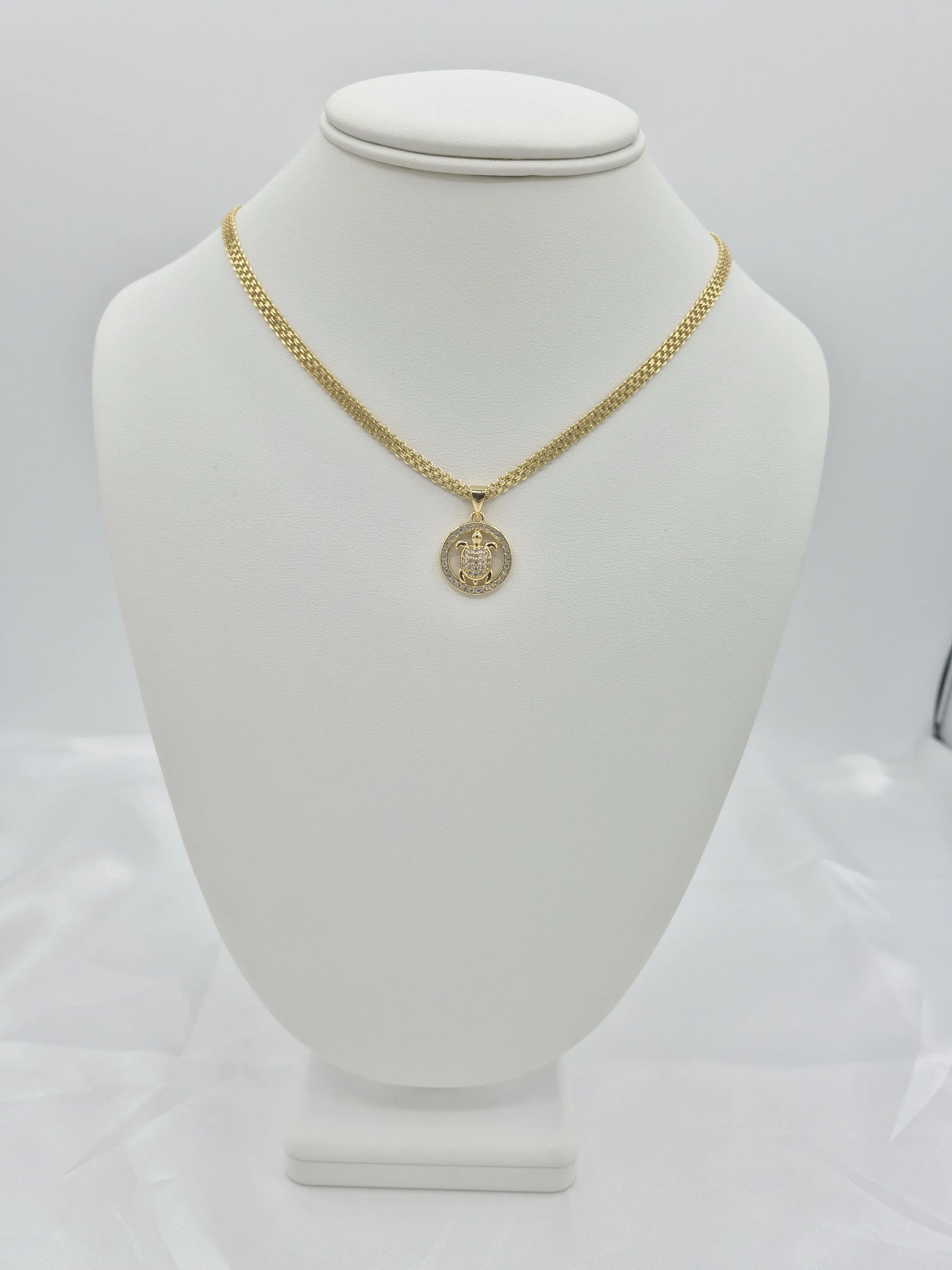 14k gold plated chain and bracelet set with turtle pendant. 14k gold plated chain and bracelet set with turtle pendant.