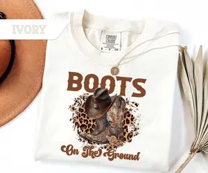 Comfort ColorsWhere Them Fans At Tee, Boots On The Ground Black Cowgirl Cowboy T-Shirt, Trail Ride Rodeo Tee Gift, Southern Cowgirl Shirt
