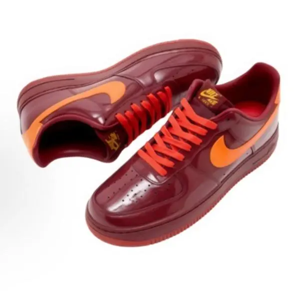 Unisex retro low‑top casual sneakers, glossy patent burgundy upper with bright‑orange accents, durable rubber outsole, sleek streamlined silhouette for street style & daily couple matching outfits