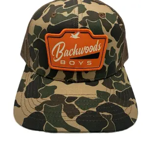 Backwoods Boys orange sublimated patch on a trucker style hat