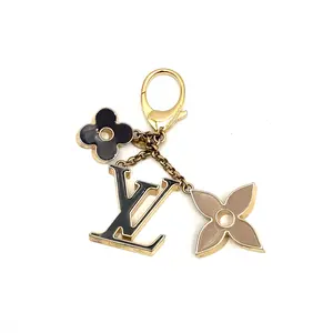 Pre-owned Louis Vuitton Canvas Coated, Enamel, Leather, Metal Bag Accessories Charm Monogram Gold #4166