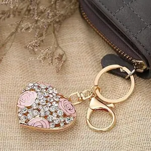 Korean-style creative small daisy flower ball keychain, gold double-sided three-dimensional hollow flower ball keyring, bag pendant for women