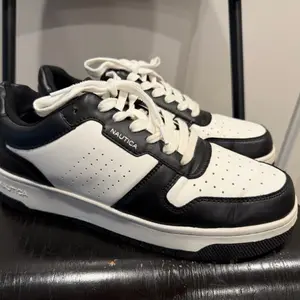 Black and white Nautica sneakers.  Size 9.5 Used good condition