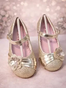 melissa Gold-colored shoes with floral details and a cross-strap design.