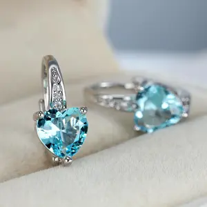 A pair of heart-shaped earrings - set with a birthstone and a turquoise center, clip-on design, suitable for everyday wear and parties - elegant heart-shaped pendant earrings, a romantic gift, playful design, and durable.