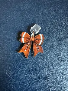 Coquette Sports Bow Device Charm