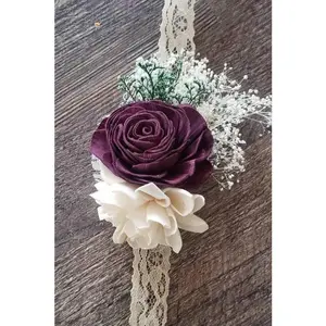 Plum wrist corsage,  sola flower wrist corsage