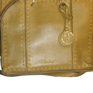 Nine West Tote Bag with Strap, Leather Material, Decorative Detailing, Classic Design, Ideal for Everyday Use