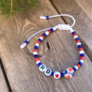 Dominican Republic Beaded Bracelet with Colorful Beads and Lettering, Featuring Red, White, and Blue Design