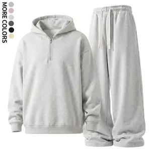 American casual two-piece set: half-zip hooded top and wide-leg drawstring sweatpants with a drapey feel, light floral gray, suitable for everyday wear and commuting.