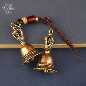 Retro Pure Brass Dorje Bell Pendant, vintage-style small bell charm with woven cord, ideal as a car keychain, bag accessory or decorative pendant, features intricate details and traditional design for spiritual decor