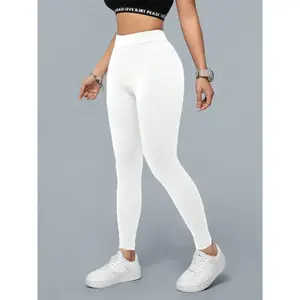 Women’s high-waisted white pencil leggings — stretchy slim-fit tummy-control pants | Crafted from soft butter fabric for all-day comfort, ideal for casual wear, workouts, and everyday outfits | Opaque, opaque, elastic waistband GARMENTARY