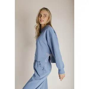 The Monzingo Bow Embroidered Pullover in Dusty Blue