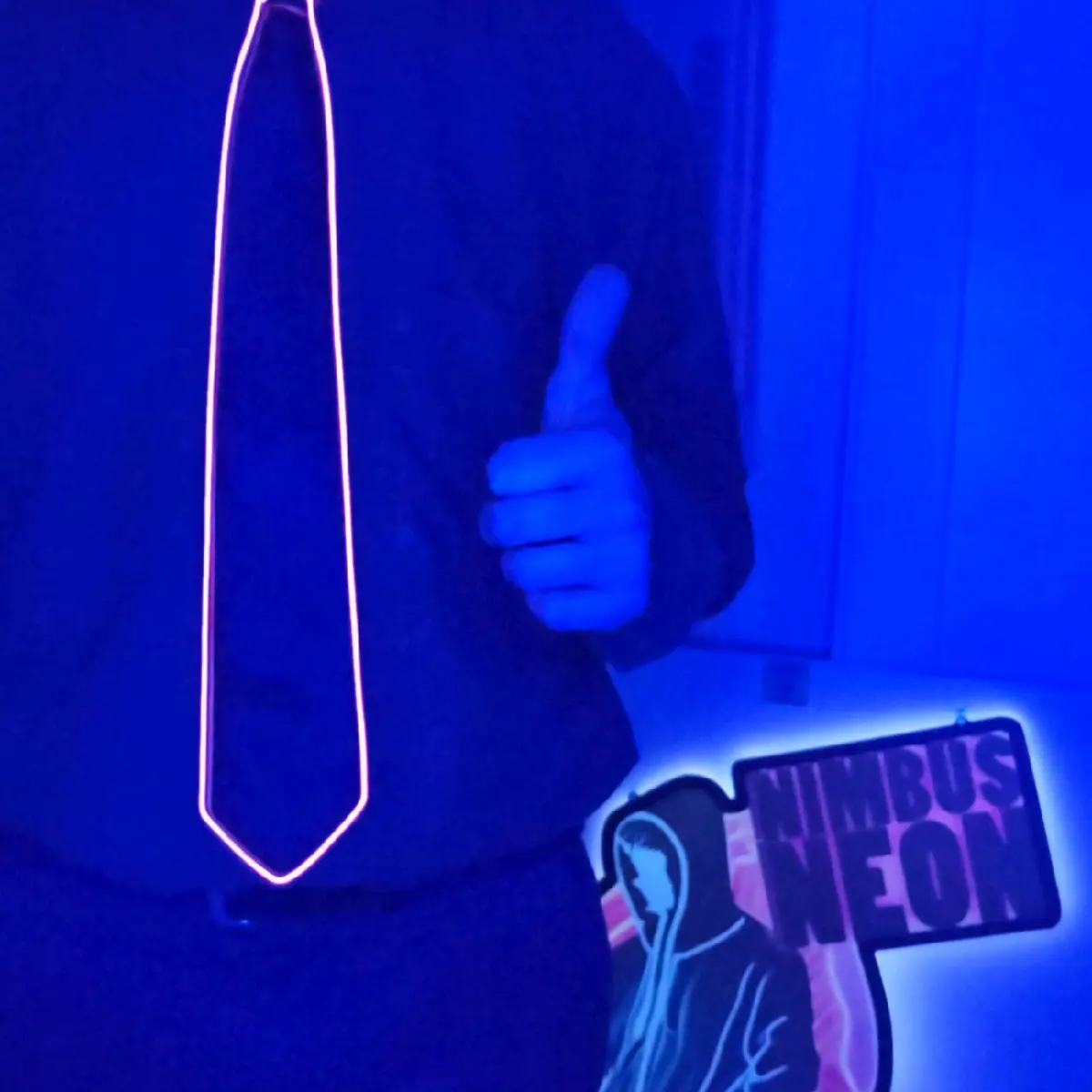 The Nimbus Neon Necktie, a light-hearted dress accessory for church, raves, parties, business, formal and casual occasions.  Zip-on, battery powered 3-option light-up LED tie with slow and fast flash, or solid illumination. By Neon Ty with the Neon Tie.