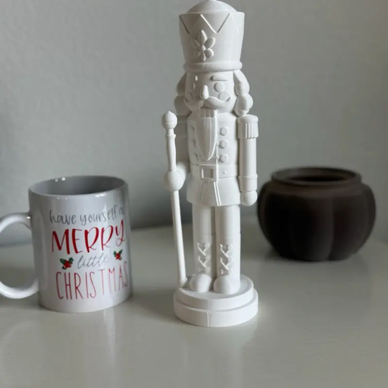 3D Printed Nutcracker Christmas Decoration  Add a festive touch to your home with this decorative 3D printed nutcracker figure. Its classic holiday-inspired design makes it a lovely addition to Christmas displays, shelves, desks, and seasonal decorations.