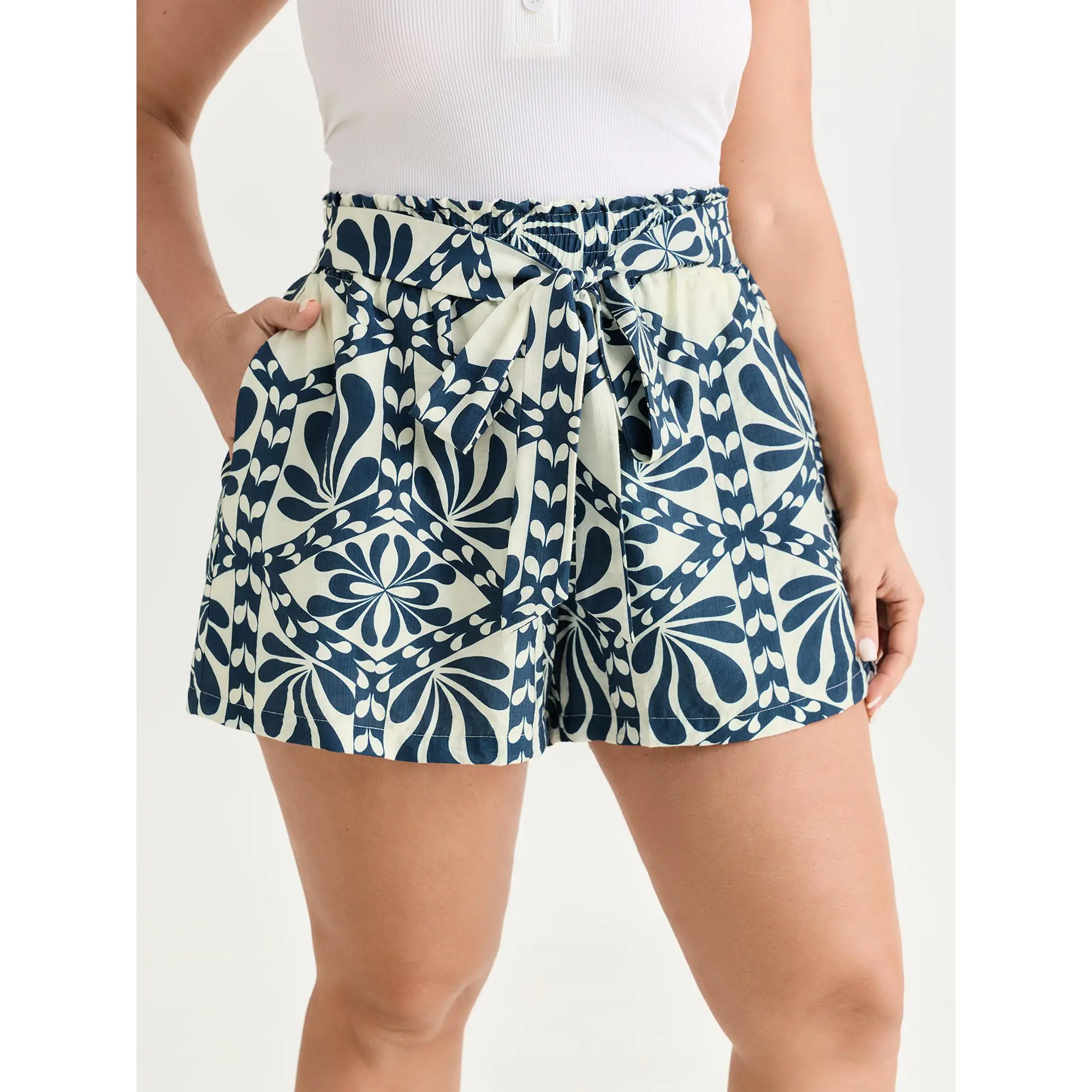 BloomChic Women's Plus Size Bohemian Summer Shorts in Ethnic Floral Rayon with a Shirred Mid Waist, Ruffled Hem, and Pockets, Garment, Bottom, Smooth, Fabric, Fit, Nylon, Polyester, Mid Rise, Clothes, Floral Print, Short Pants, Rayon Blend, Smocked Waist,