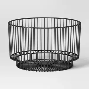 Black 18" x 11" Metal Wire Basket Metal frame construction lends a classic, modern look Use it as a chic decorative accent or for storage of essentials Can be spot cleaned for easy care