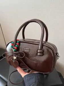 Textured casual hand-held pillow bag, trendy and versatile one-shoulder bowling bag, simple niche design one-shoulder crossbody bag, paired with exquisite pendants, suitable for commuting, dating, shopping and other scenarios, Commuter Purse