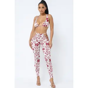 PRINTED BRA TOP AND PANTS WITH SIDE CUTOUTS