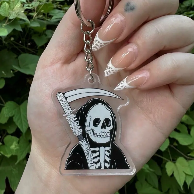 Coilover Grim Reaper Scythe Car Keychain - Clear Acrylic Design with Skeleton Graphic and Chain Attachment