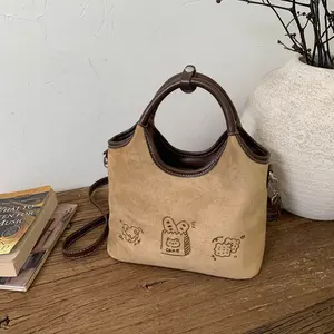 Women's Stylish Camel Suede Bucket  - Crossbody & Shoulder  with Cartoon Snack Print and Adorable Plush Dog Charm Vintage Monogram Hobo
