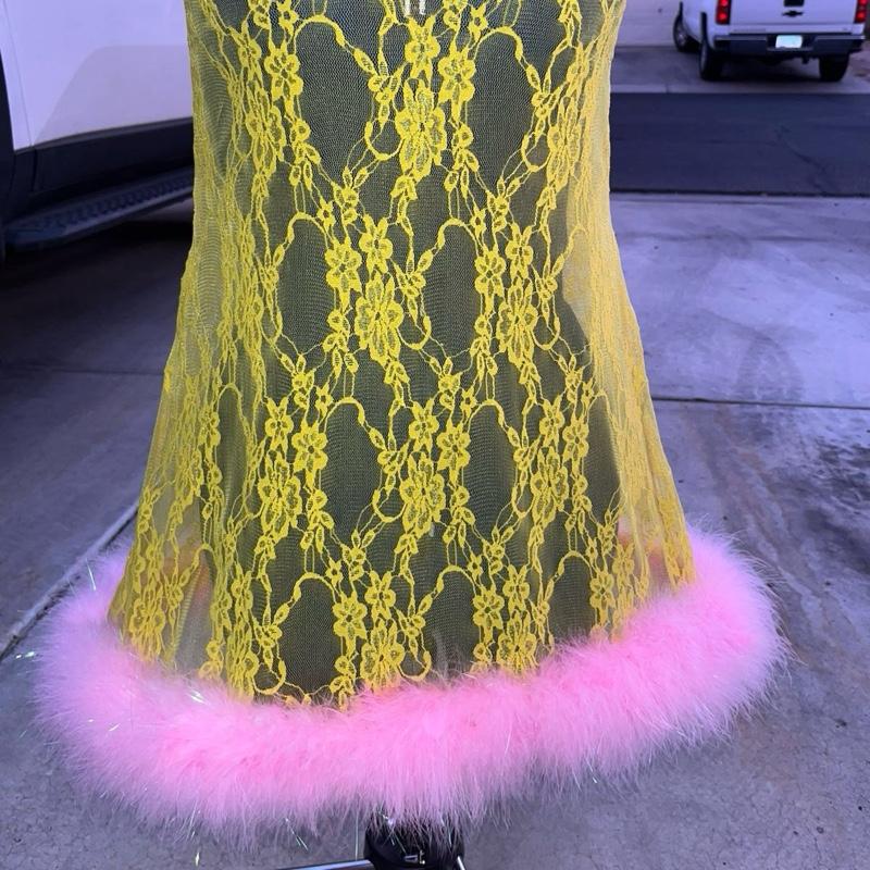 Pink lemonade lace dress with ostrich feathers