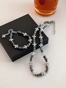 A two-piece set of trendy hip-hop style cross flower collarbone chains and spliced beaded bracelets, suitable for couples to wear
