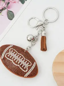 A creative sports keychain charm with rhinestones featuring football, basketball, and other designs, suitable for daily wear, vacations, dates, and other occasions, and also a delightful and exquisite small gift.