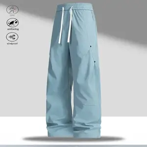 A pair of wide leg casual pants, featuring a casual and simple style, with an adjustable drawstring at the waist for convenience. The wide leg design is practical and versatile, while the side pockets and button details add a stylish touch. The fabric is