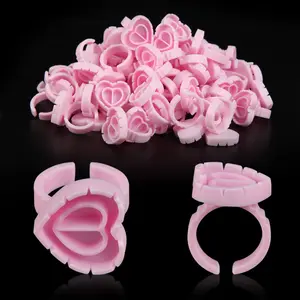 100PCS Disposable Glue Rings - Pink Heart-Shaped Plastic Lash Glue Holders, Essential Auxiliary Tool for Eyelash Extensions, Grafting & Tattoo, Perfect Pigment Rings for Beauty Professionals, Cosmetic Makeup Tool