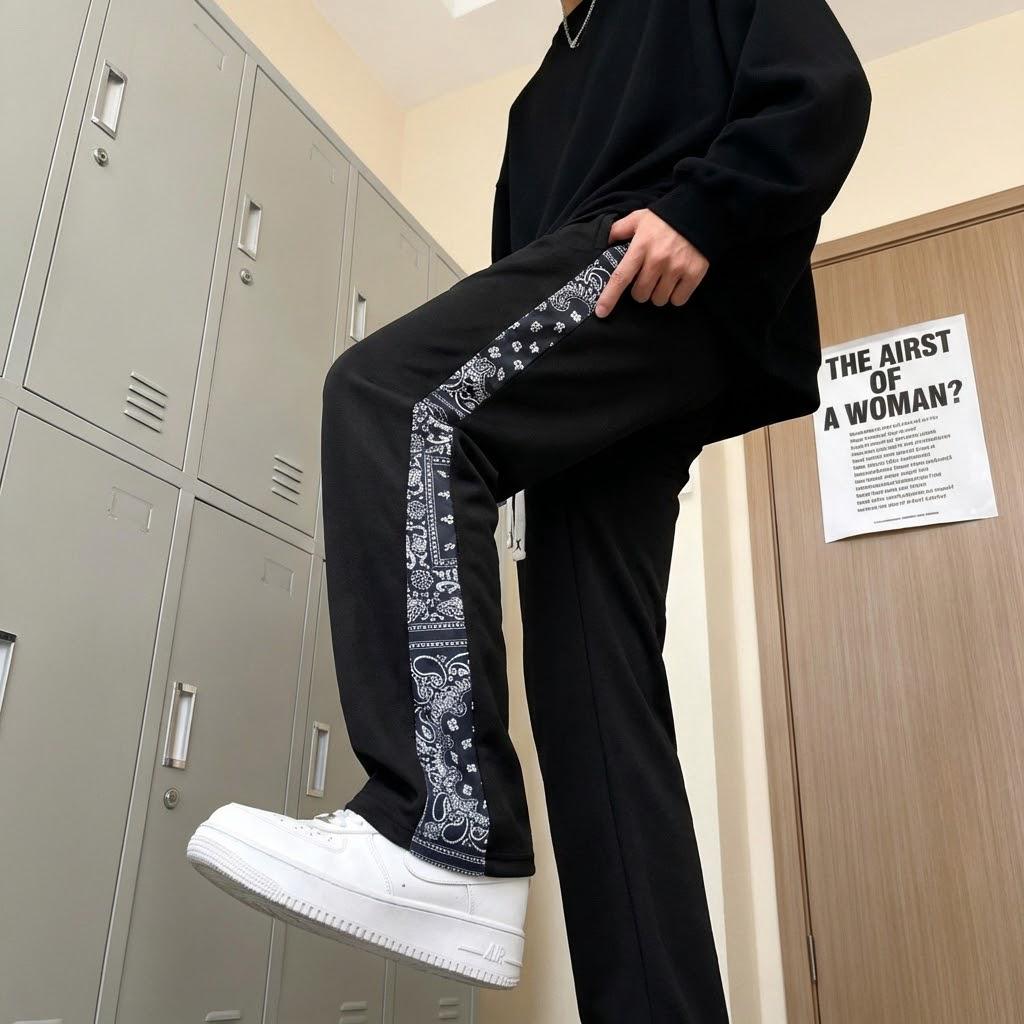 Men’s casual pants featuring an elastic waistband and drawstring design, floral side pattern, side pockets, and slight stretch—comfortable athletic casual pants.