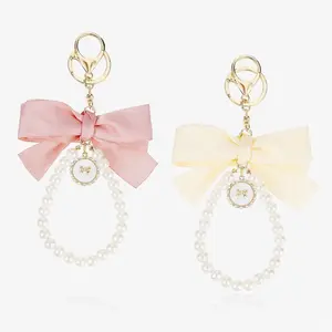 Elegant Bow Pearl Keychain Set – 2 Pack Sakura Bowknot Wristlet Keychains with Tassel, Cute Bag Charm & Car Key Ring for Women