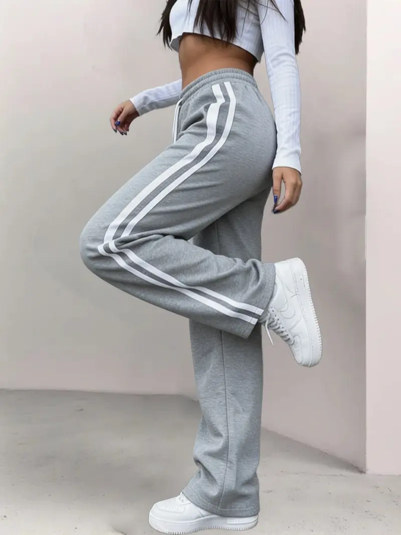 Women’s retro joggers with double white stripes on the sides, slight flare, high waist with drawstring, drapey floor-length casual pants backtoschool