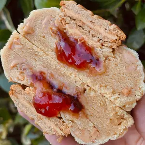 Peanut Butter & Jelly - Peanut butter cookie base that we load up with Reese's peanut butter chips and fill with a heaping amount of strawberry jam! It's then topped off with a peanut butter cream sandwich cookie.
