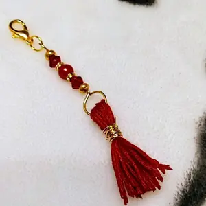 handmade tassel purse or zipper pull for jackets and journals too. in red, orange, white, blue, green, pink, and yellow with faux pearls a d accent beads.