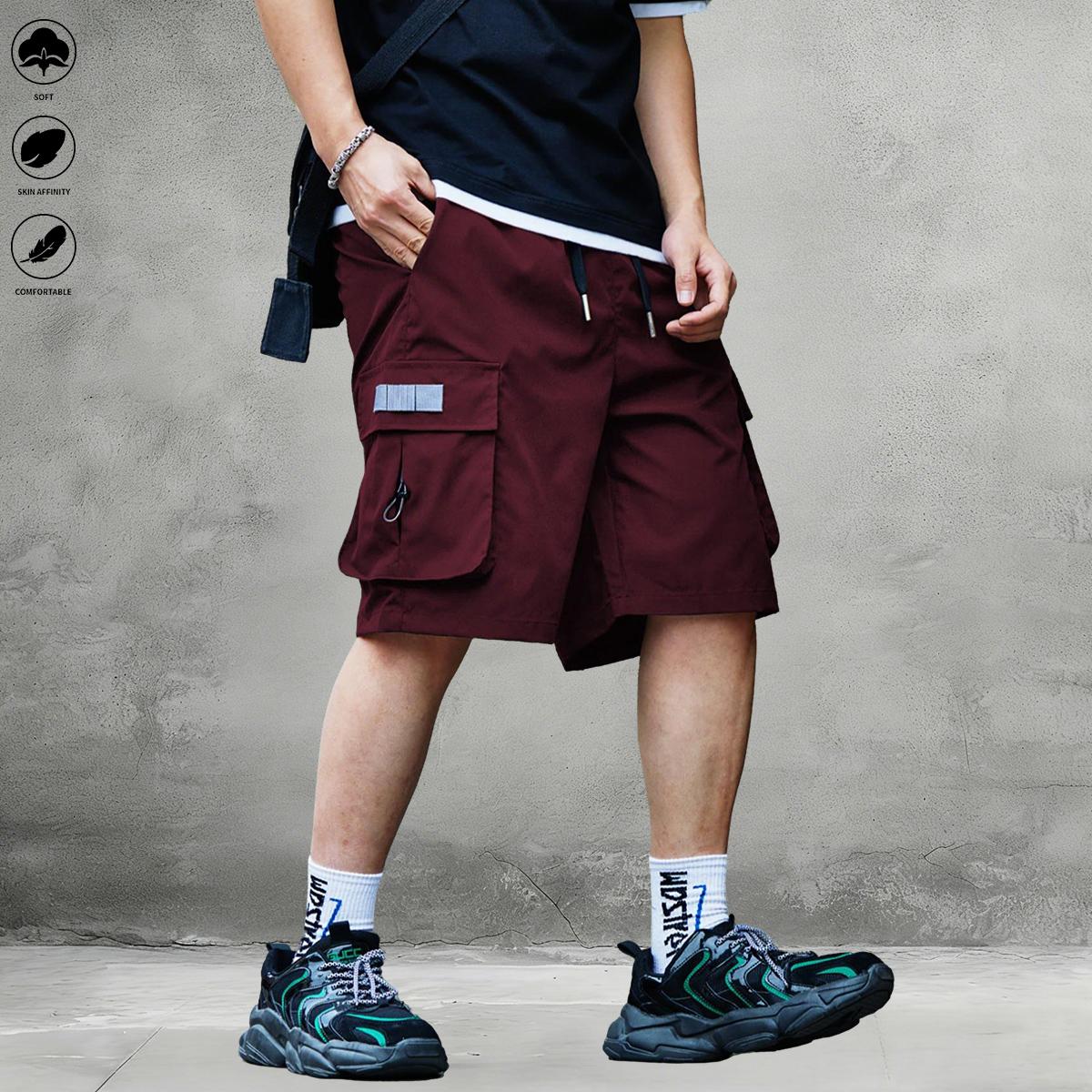 New summer men’s tactical cargo shorts with multiple pockets, made from breathable, quick-dry fabric with slight stretch; suitable for casual outings and travel; elastic drawstring waist for relaxed wear.