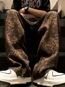 Unisex street style leopard-print full-length pants with a relaxed fit, drawstring waistband, comfortable and casual design. Perfect for casual daily wear, stylish and sensual leopard prints suitable for hip-hop, school events, parties, and commuting.
