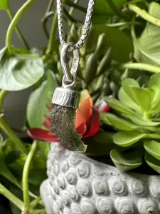 Authentic Moldavite Pendant with Necklace: A 1.6 grams genuine celestial gem, verified for authenticity. Embrace cosmic energies, deepen your spiritual connection, and leap to a transformation journey. Elevate your style and consciousness now.
