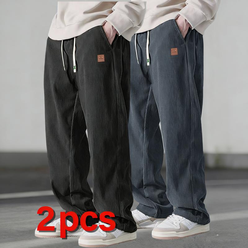 Two men's autumn casual pants featuring a simple and versatile style with drawstring design, adding a casual feel. The pants have delicate small details, such as stitching accents, making them comfortable and stylish. The loose fit provides comfort and fr