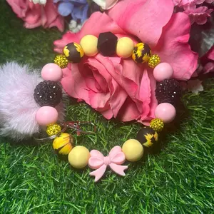 Sunny bloom wristlet keychain color scheme light pink, light yellow, sunflower print and bling beads made with wire