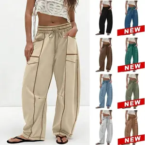 Women's high waisted bucket shaped sports pants, loose wide leg drawstring running pants with pockets and stitching details, sports and casual pantsRAIMENTRY